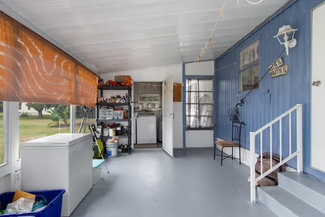 a view of livingroom with furniture and windows