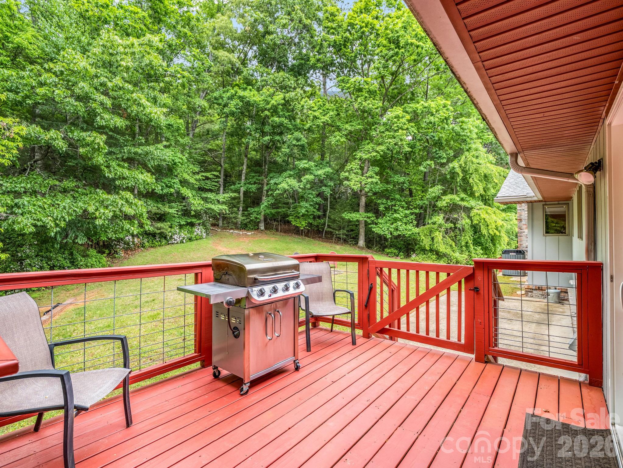656 Cashiers Valley Road Brevard, NC 28712 - Photo 32 of 37 a view of a deck with wooden floor and seating space