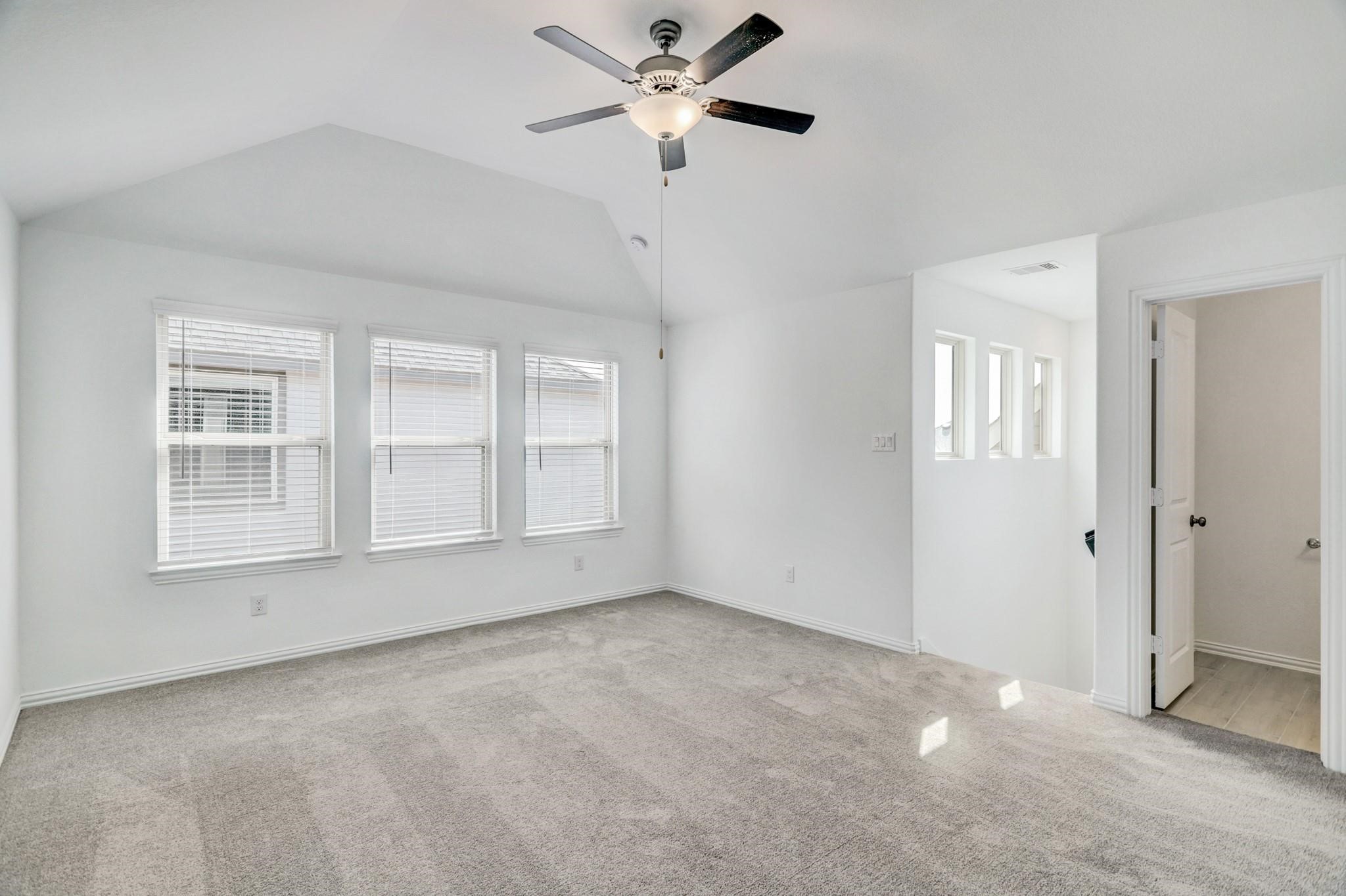 21015 Morning Nectar Lane Cypress, TX 77433 - Photo 11 of 34 a view of an empty room with a window