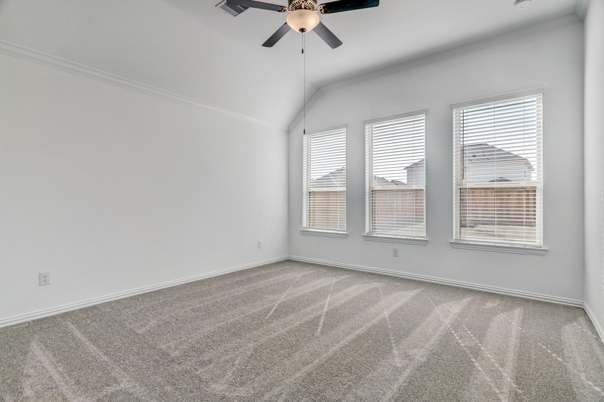 21015 Morning Nectar Lane Cypress, TX 77433 - Photo 12 of 34 a view of an empty room with a window