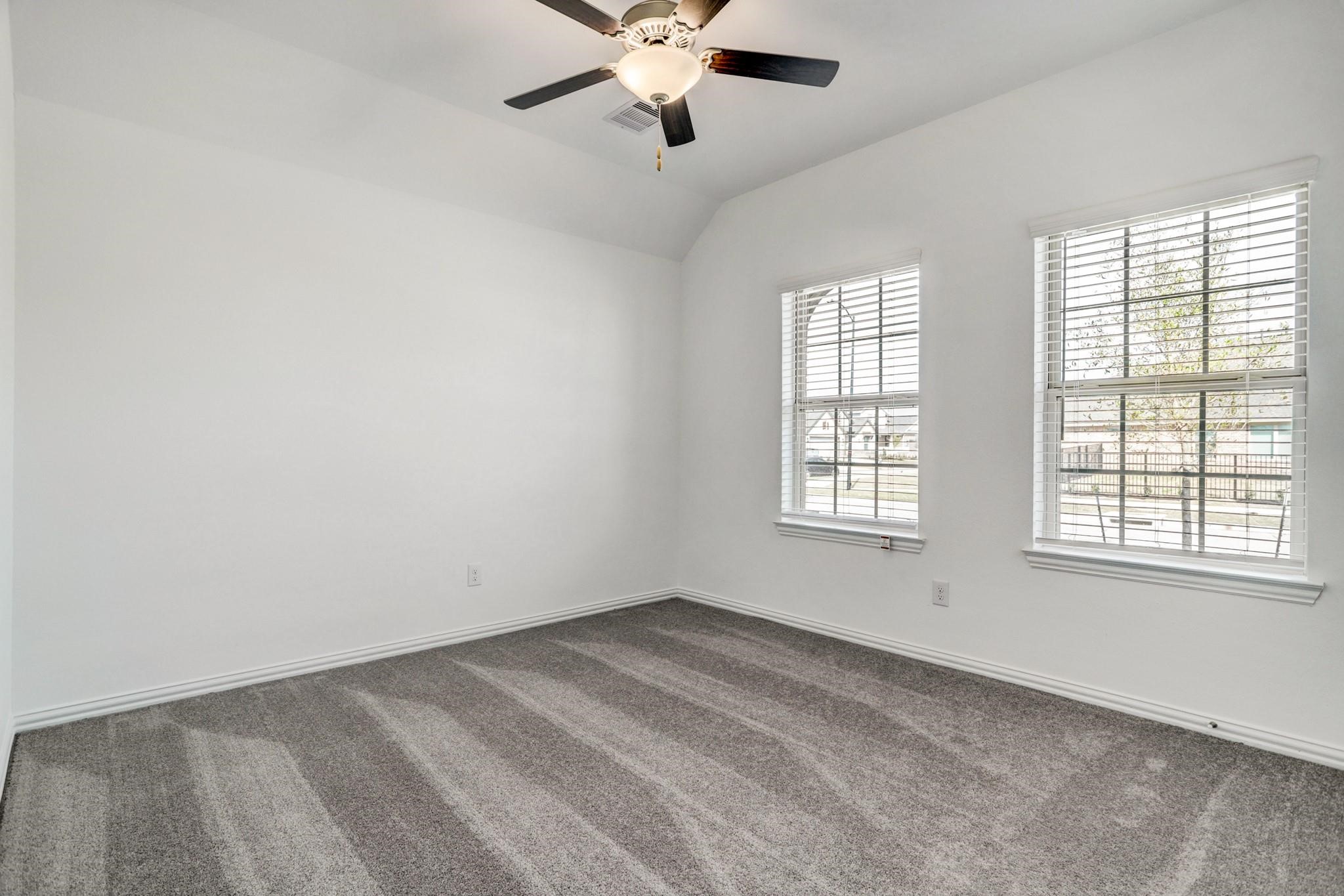21015 Morning Nectar Lane Cypress, TX 77433 - Photo 18 of 34 a view of an empty room with a window