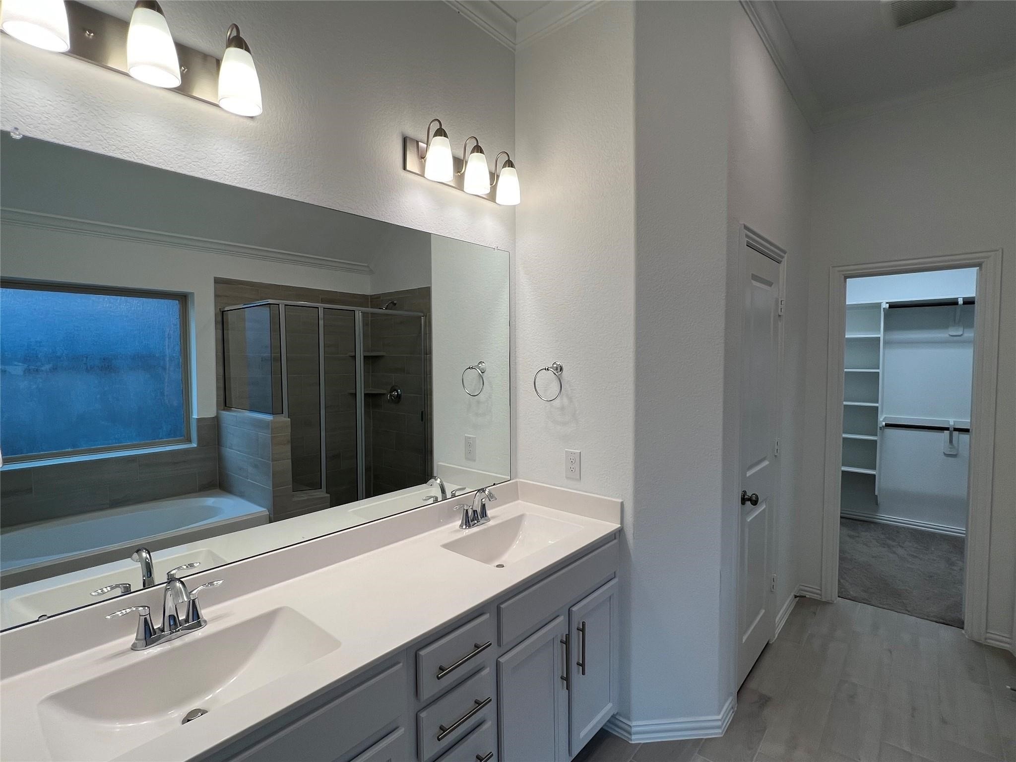 21015 Morning Nectar Lane Cypress, TX 77433 - Photo 23 of 34 a bathroom with a sink double vanity and a mirror