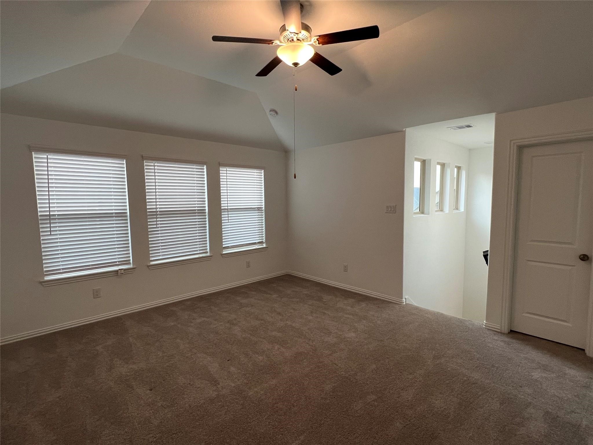 21015 Morning Nectar Lane Cypress, TX 77433 - Photo 30 of 34 a view of an empty room with a window