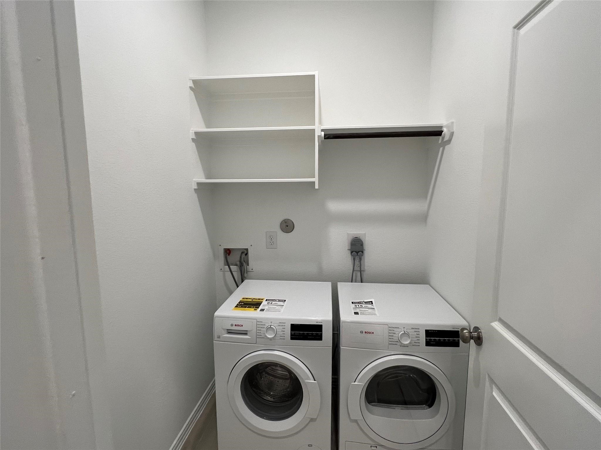 21015 Morning Nectar Lane Cypress, TX 77433 - Photo 32 of 34 a utility room with dryer and washer