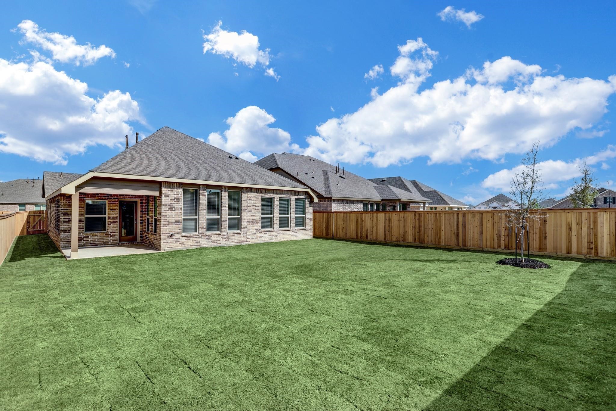 21015 Morning Nectar Lane Cypress, TX 77433 - Photo 33 of 34 a view of a house with a yard