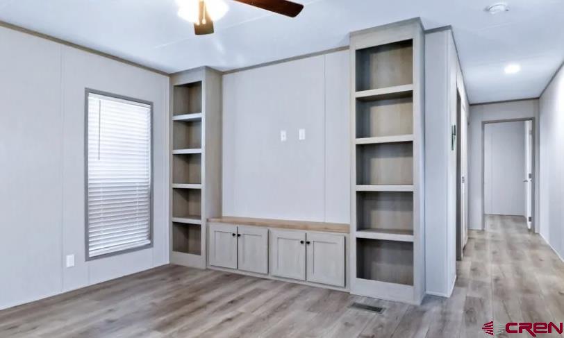 62650 Lasalle Road, Unit 317 Montrose, CO 81403 - Photo 13 of 23 an empty room with closet and windows