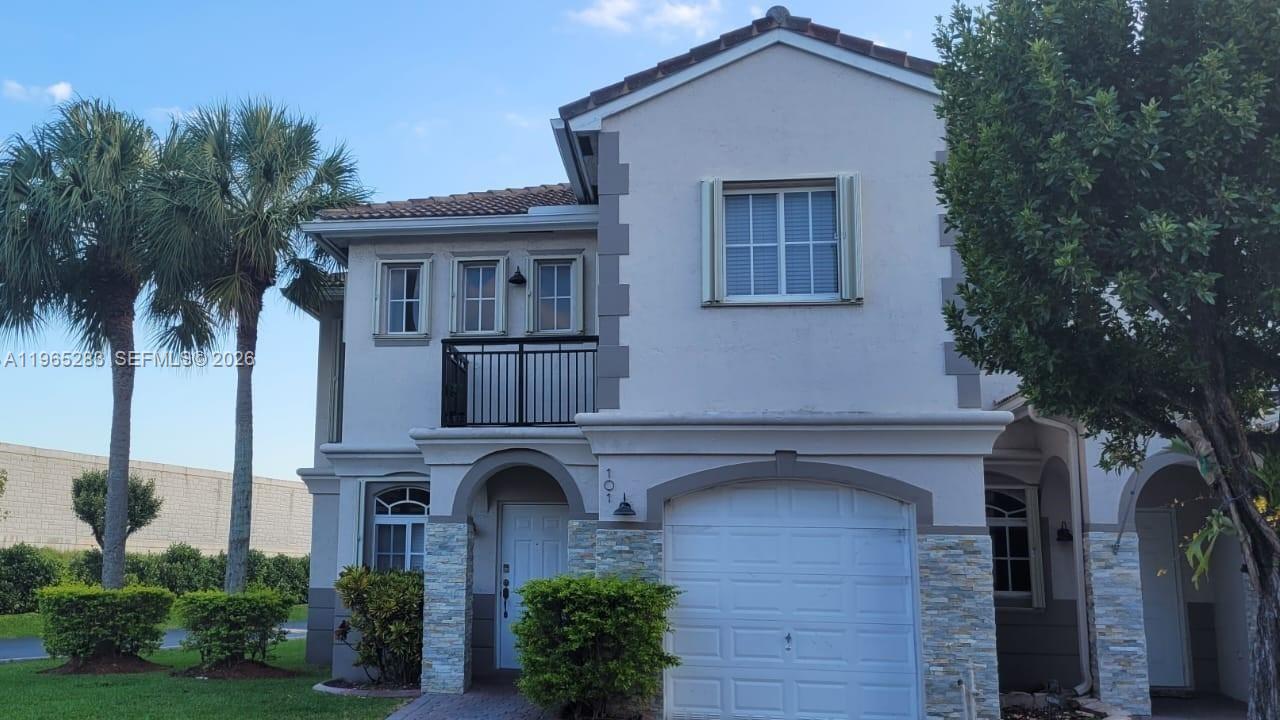 a front view of a house with garden
