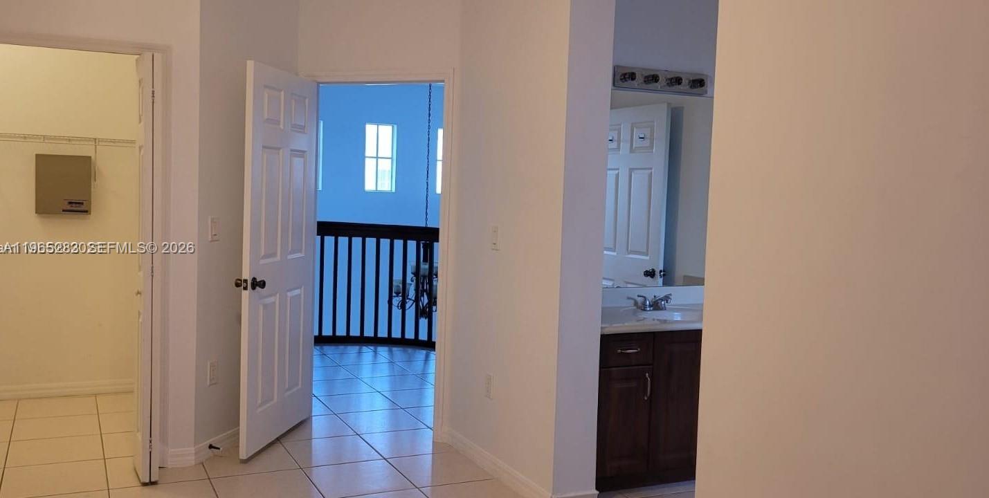 8331 Southwest 124th Avenue, Unit 10114 Miami, FL 33183 - Photo 11 of 19 a view of a hallway with entryway door