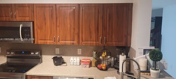a kitchen with a sink and cabinets
