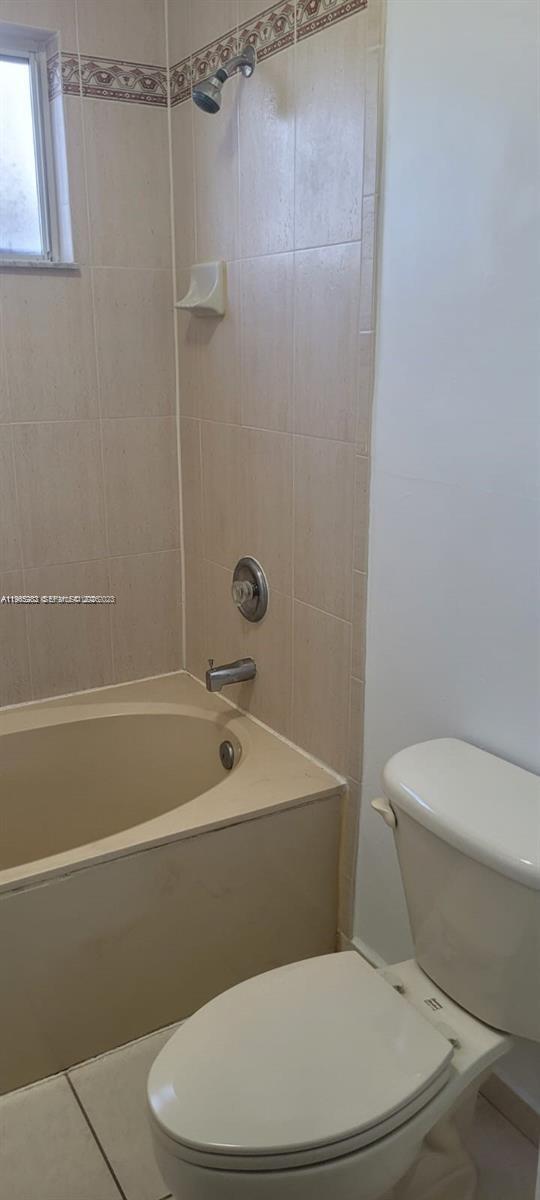 8331 Southwest 124th Avenue, Unit 10114 Miami, FL 33183 - Photo 10 of 19 a white toilet sitting next to a bath tub