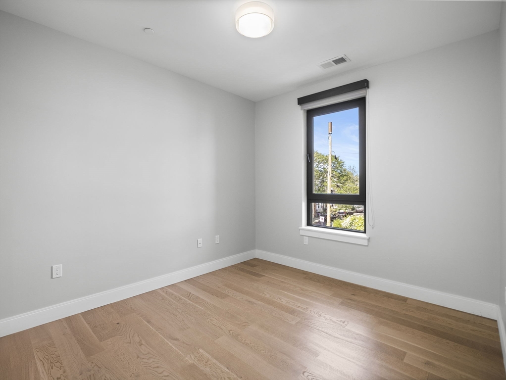9 Central Street, Unit 207 Somerville, MA 02143 - Photo 10 of 32 an empty room with a window