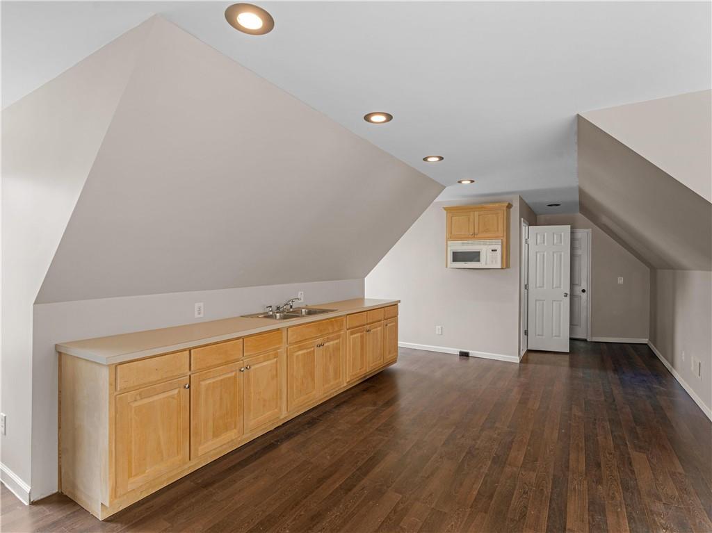 1695 Whitley Road Dacula, GA 30019 - Photo 13 of 153 a view of an empty room with wooden floor