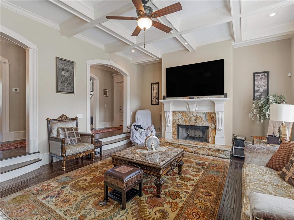 1695 Whitley Road Dacula, GA 30019 - Photo 42 of 153 a living room with furniture a flat screen tv and a fireplace