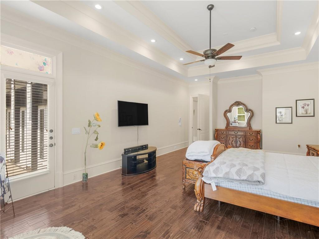 1695 Whitley Road Dacula, GA 30019 - Photo 57 of 153 a bedroom with a bed window and a flat screen tv