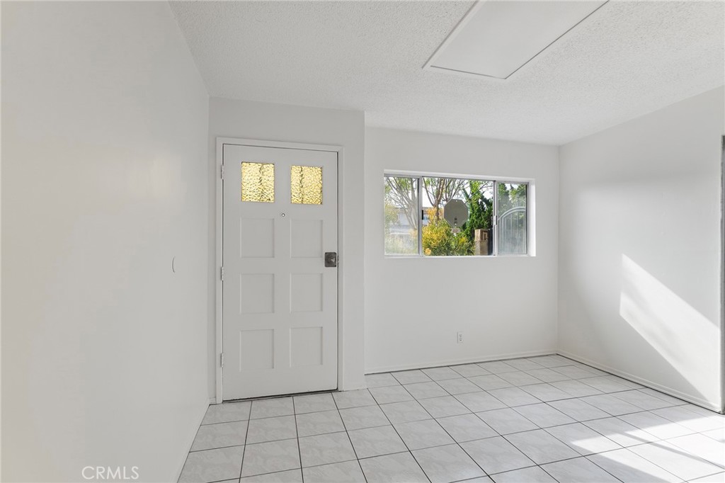 807 East Calbas Street Carson, CA 90745 - Photo 6 of 31 an empty room that has a window