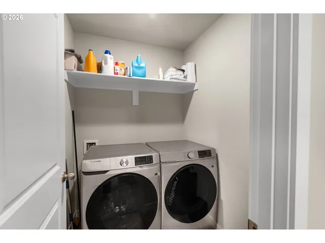 a utility room with dryer and washer
