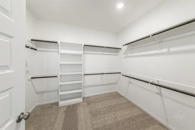 a view of an empty walk in closet