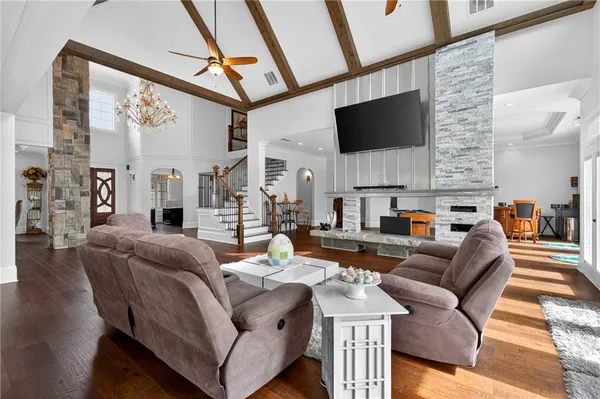 a kitchen with stainless steel appliances granite countertop a stove a sink dishwasher and a refrigerator