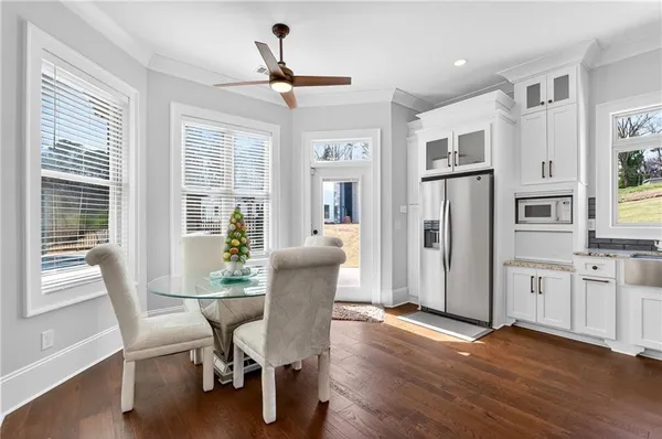 a living room with furniture and kitchen view