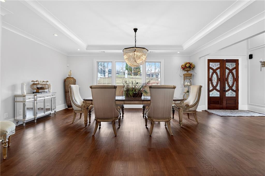 3944 Hamilton Mill Road Buford, GA 30519 - Photo 19 of 55 a view of a dining room with furniture window and wooden floor