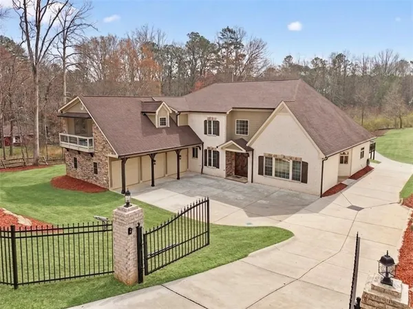 a aerial view of a house with swimming pool and deck