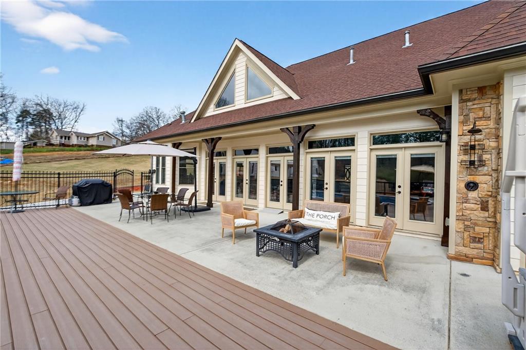 3944 Hamilton Mill Road Buford, GA 30519 - Photo 24 of 55 a view of a dinning table and chairs in the roof deck