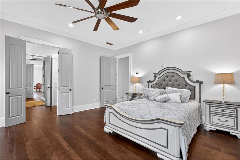 3944 Hamilton Mill Road Buford, GA 30519 - Photo 39 of 55 a bedroom with a bed and wooden floor