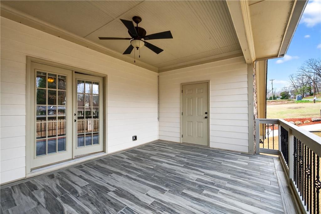 3944 Hamilton Mill Road Buford, GA 30519 - Photo 48 of 55 a view of empty room with wooden floor and fan
