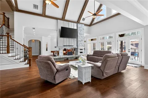 a kitchen with stainless steel appliances granite countertop a stove cabinets and wooden floor