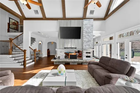 a kitchen with stainless steel appliances granite countertop a stove a sink dishwasher and a refrigerator