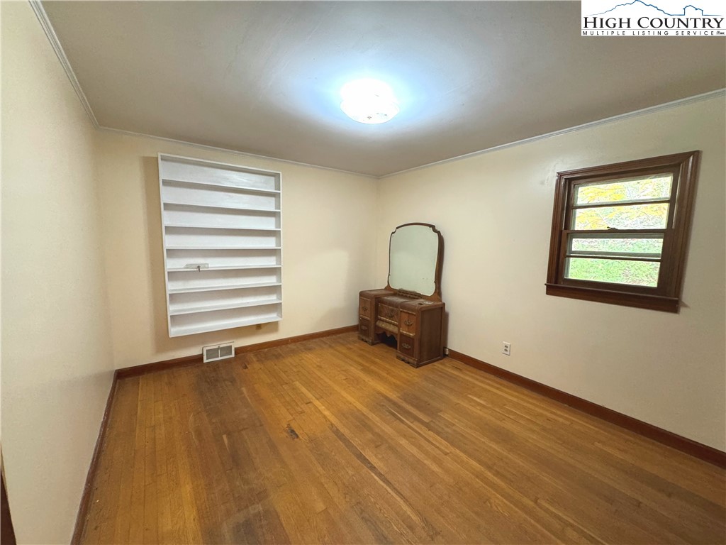 2510 Rich Hill Road Creston, NC 28615 - Photo 17 of 38 a view of a room that has a bed and a chair in it