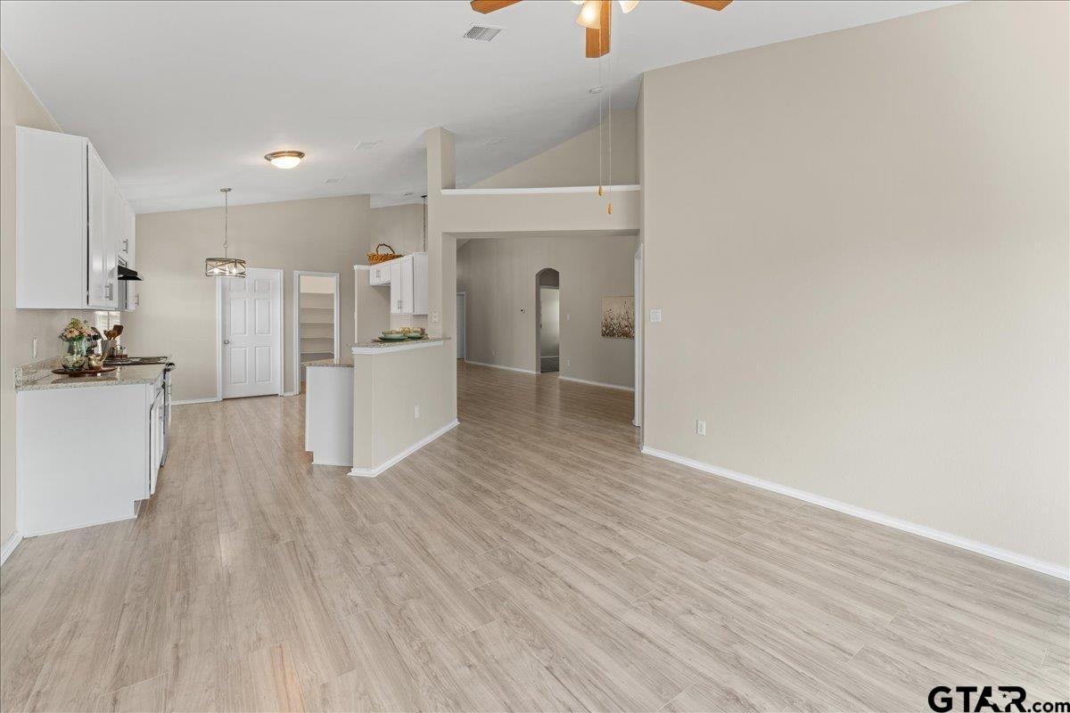 205 Freedom Trail Forney, TX 75126 - Photo 16 of 41 a view of a kitchen with wooden floor