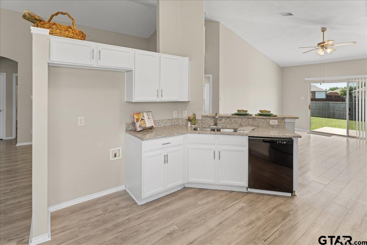 205 Freedom Trail Forney, TX 75126 - Photo 20 of 41 a kitchen with granite countertop white cabinets and white appliances