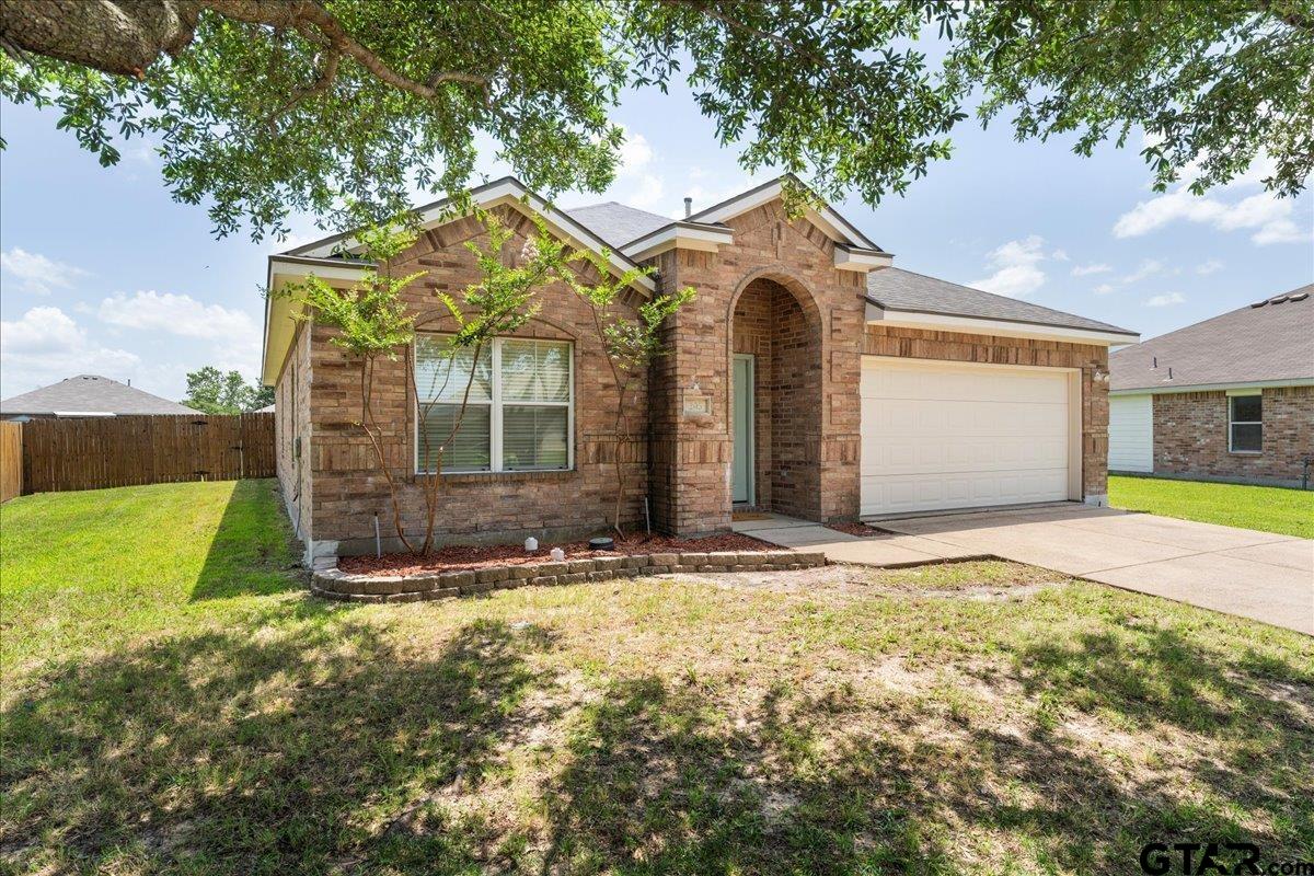 205 Freedom Trail Forney, TX 75126 - Photo 2 of 41 a front view of a house with garden
