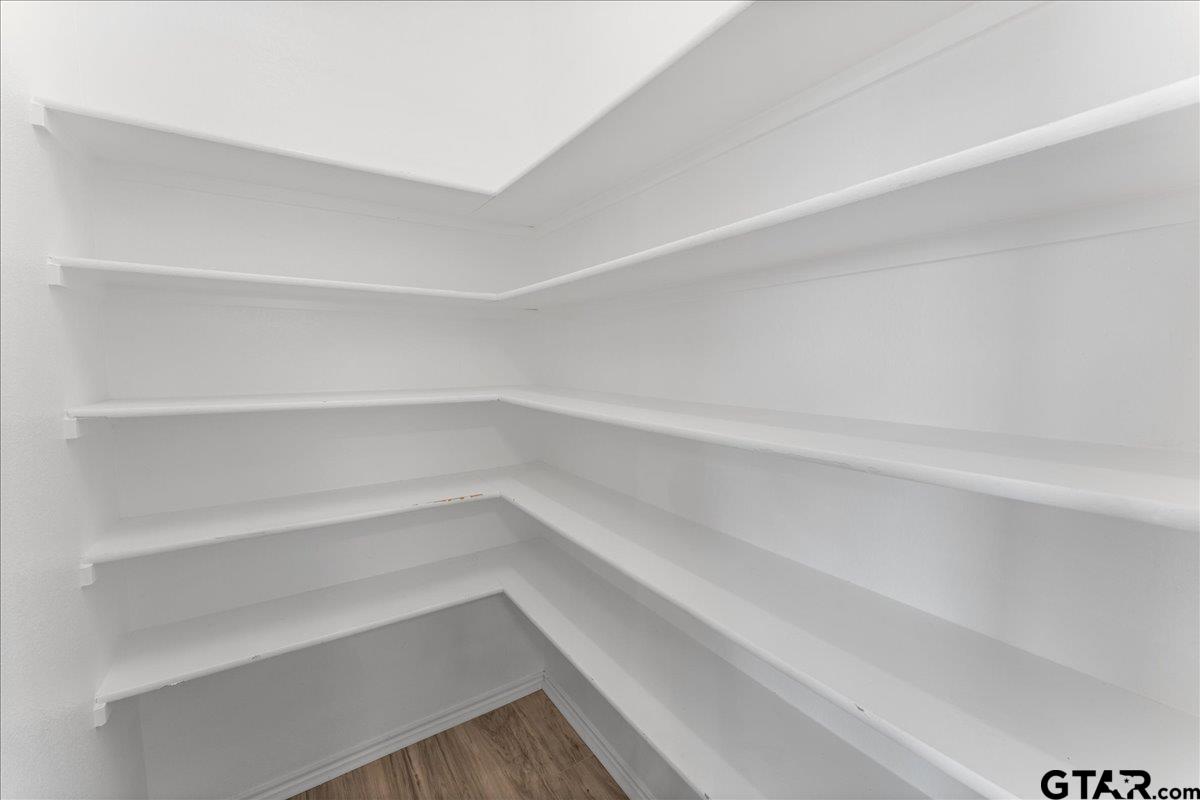 205 Freedom Trail Forney, TX 75126 - Photo 22 of 41 a view of walk in closet with empty racks