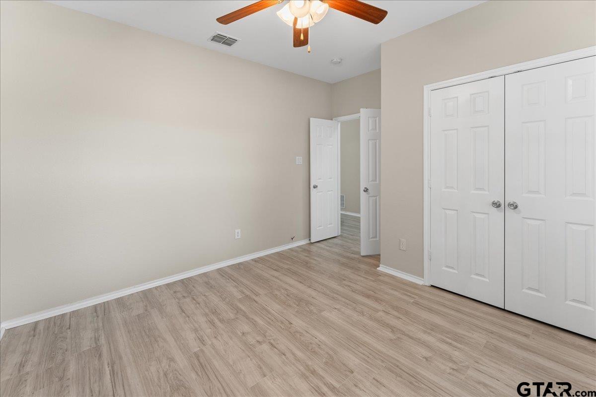 205 Freedom Trail Forney, TX 75126 - Photo 29 of 41 wooden floor in an empty room