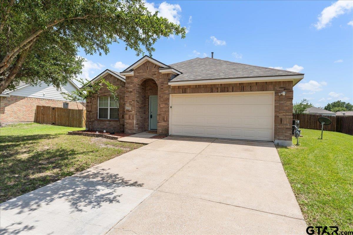 205 Freedom Trail Forney, TX 75126 - Photo 3 of 41 a front view of a house with a yard and garage