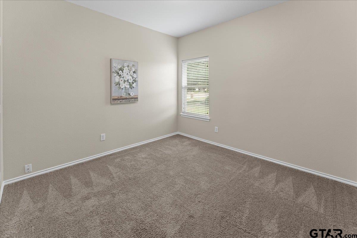 205 Freedom Trail Forney, TX 75126 - Photo 32 of 41 an empty room with windows