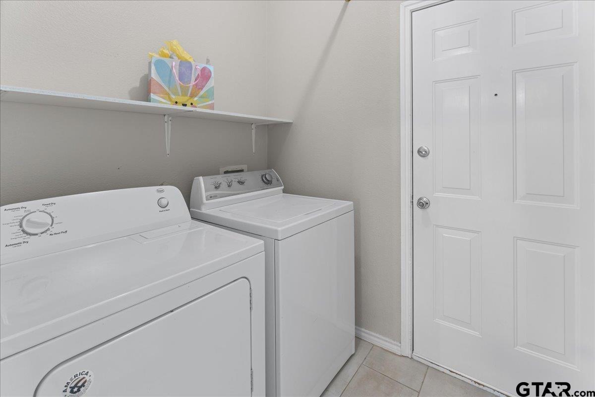 205 Freedom Trail Forney, TX 75126 - Photo 36 of 41 a utility room with dryer and washer