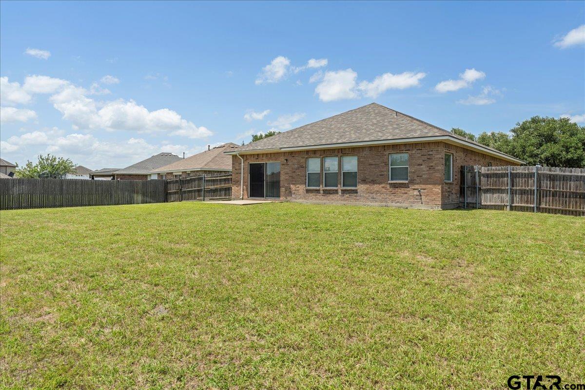205 Freedom Trail Forney, TX 75126 - Photo 38 of 41 a view of a house with a yard and potted plants