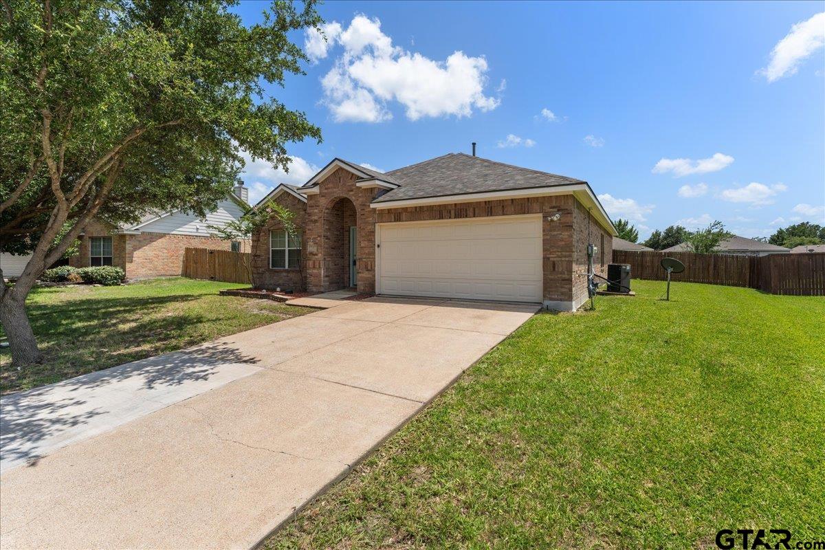 205 Freedom Trail Forney, TX 75126 - Photo 4 of 41 a front view of a house with a yard and garage