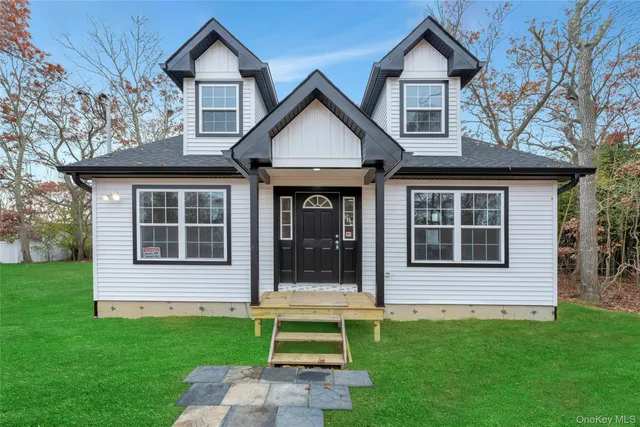 a view of an house with backyard space and garden