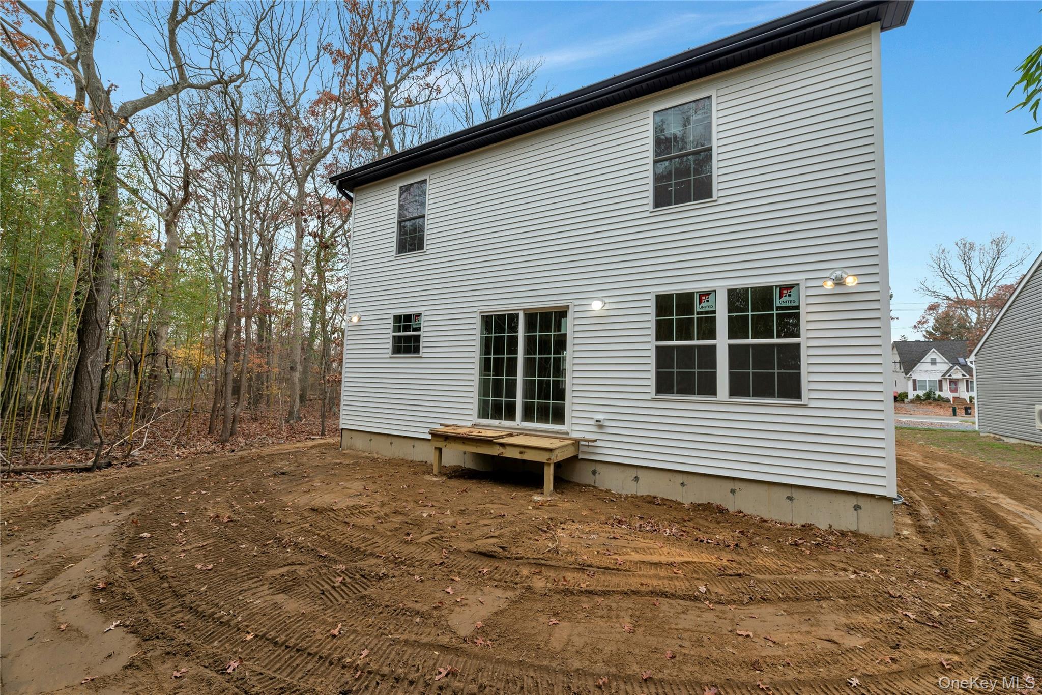 487 Neighborhood Road Shirley, NY 11967 - Photo 15 of 20 a front view of a house with a yard
