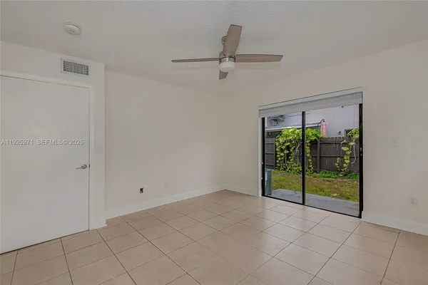a view of an empty room and window