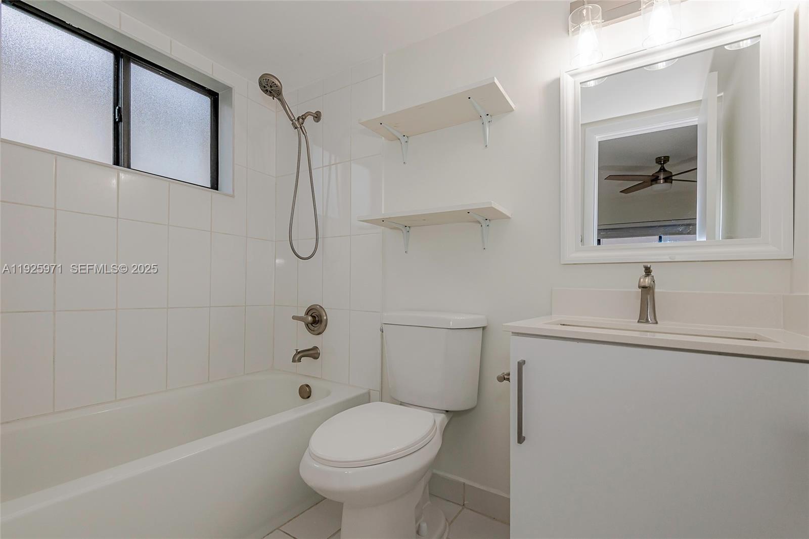 Hialeah Hialeah, FL 33012 - Photo 23 of 27 a bathroom with a sink a toilet and shower