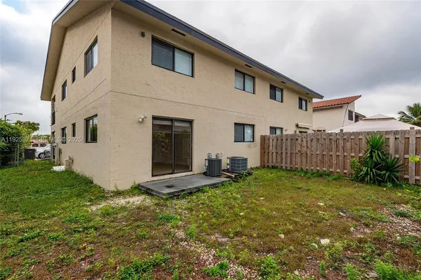 a view of a backyard of the house