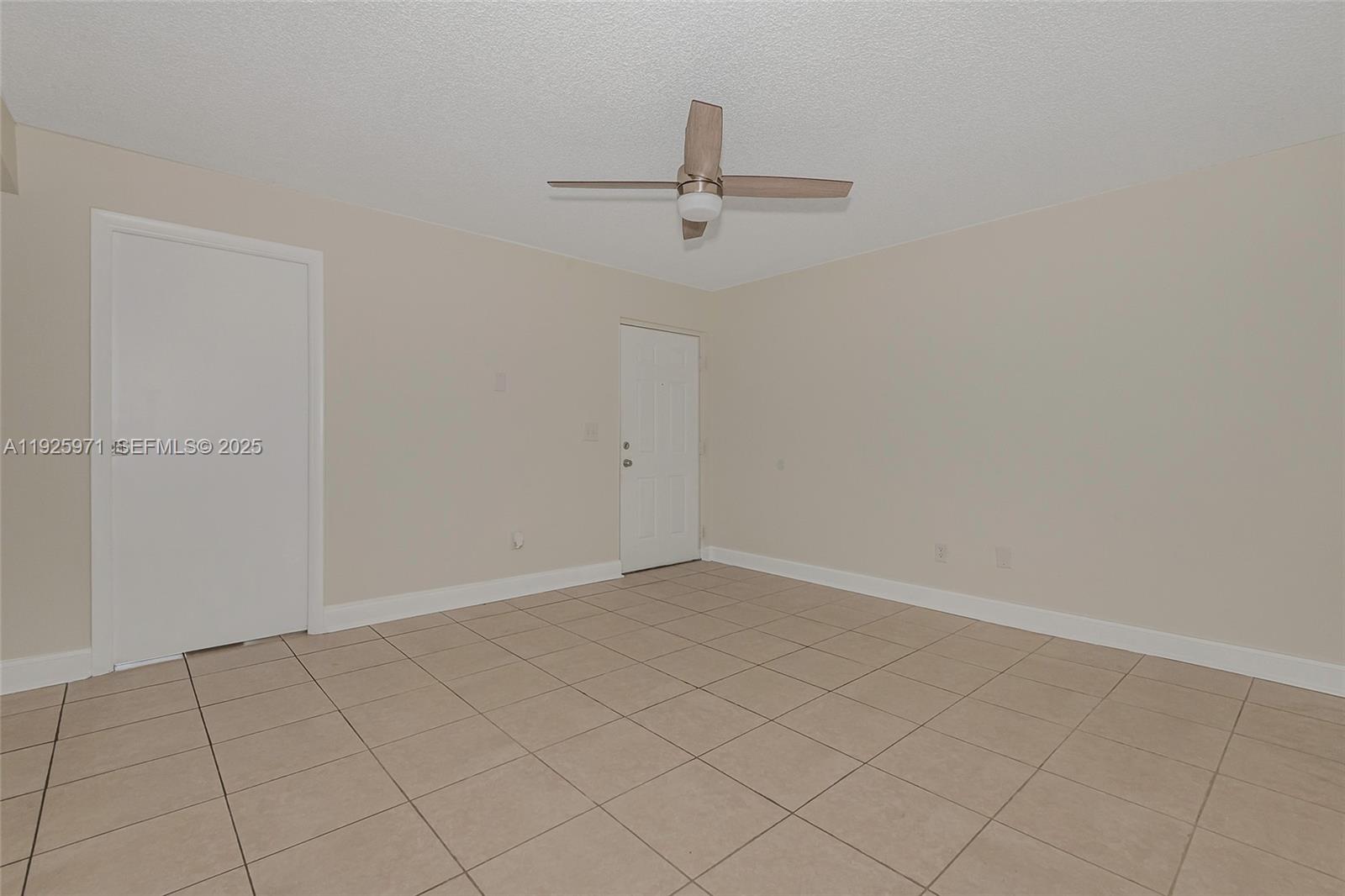 Hialeah Hialeah, FL 33012 - Photo 6 of 27 an empty room with a ceiling fan
