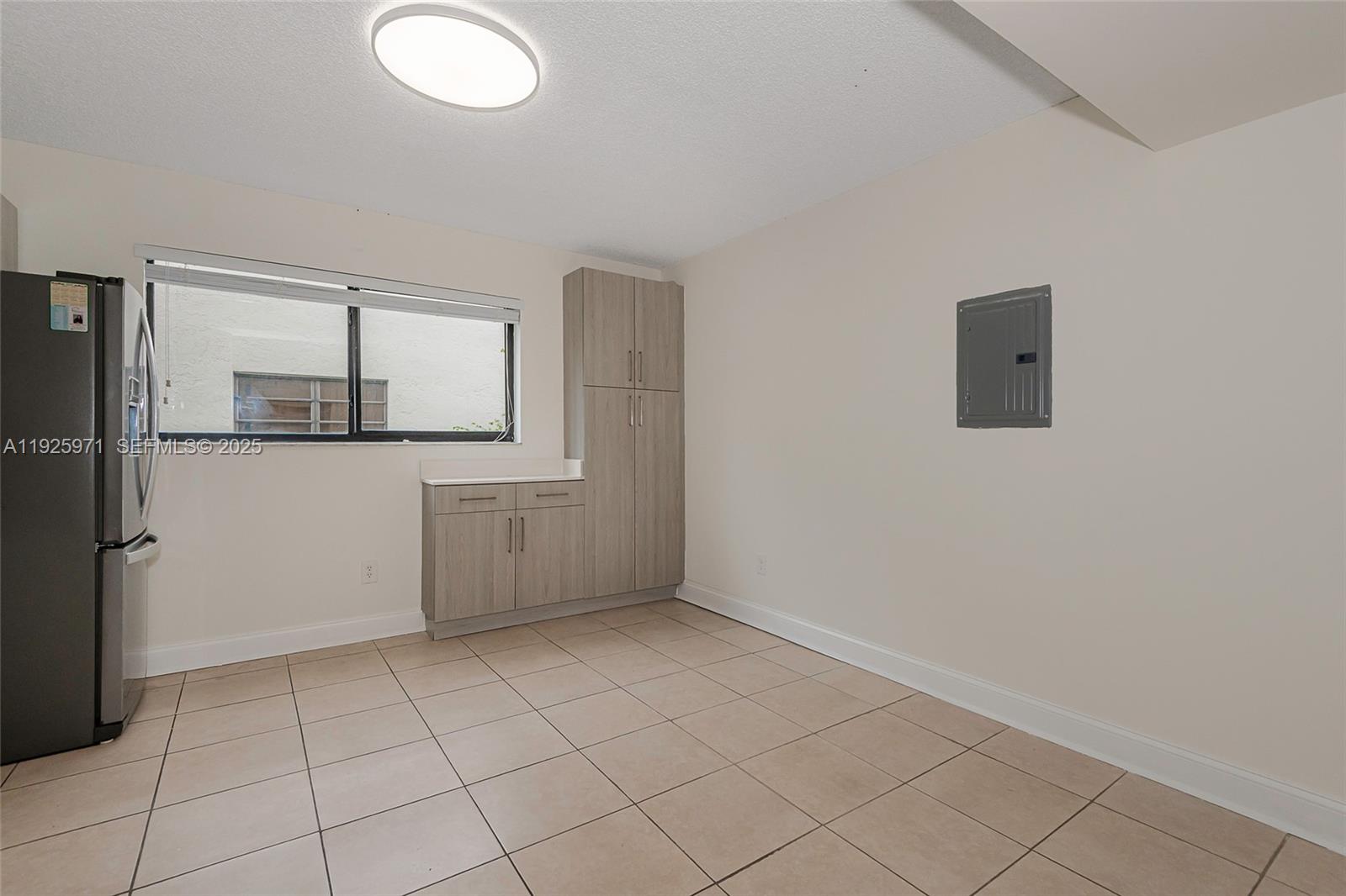 Hialeah Hialeah, FL 33012 - Photo 7 of 27 a view of a kitchen with a microwave and cabinets