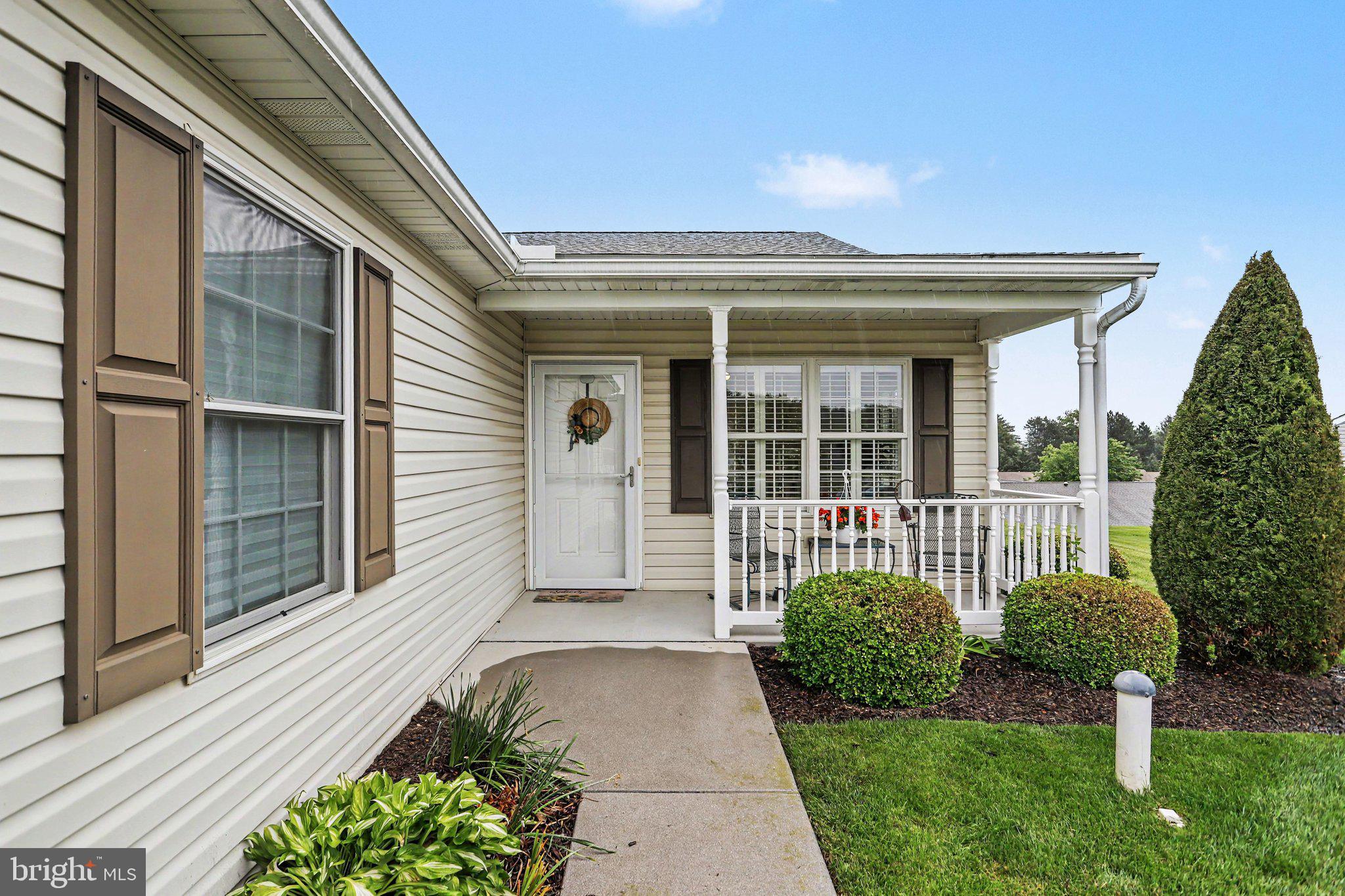 1371 Chami Drive, Unit 166 Spring Grove, PA 17362 - Photo 3 of 28 a front view of a house with garden