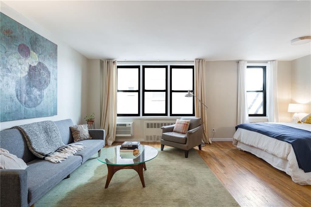 515 East 7th Street, Unit 3P Brooklyn, NY 11218 - Photo 4 of 14 a living room with furniture and a window